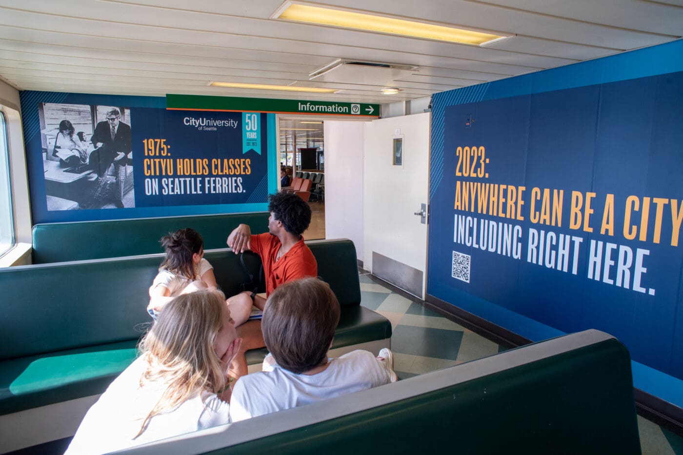 outdoor advertising on the Washington state ferry walls in Seattle displaying city university of Seattle