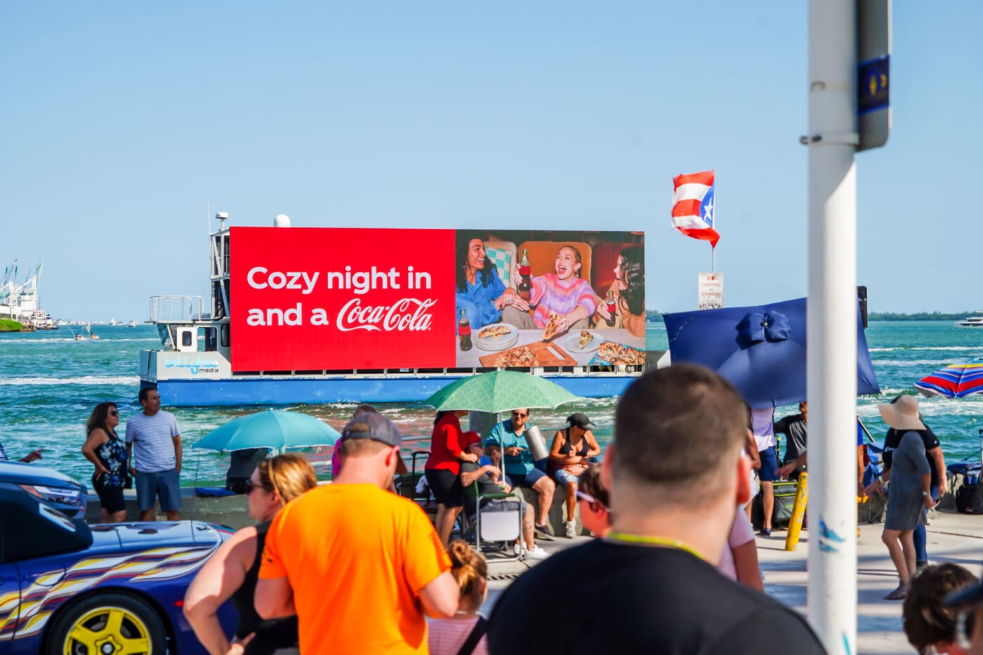 outdoor advertising in downtown Miami along bayside marketplace with Coca Cola.
