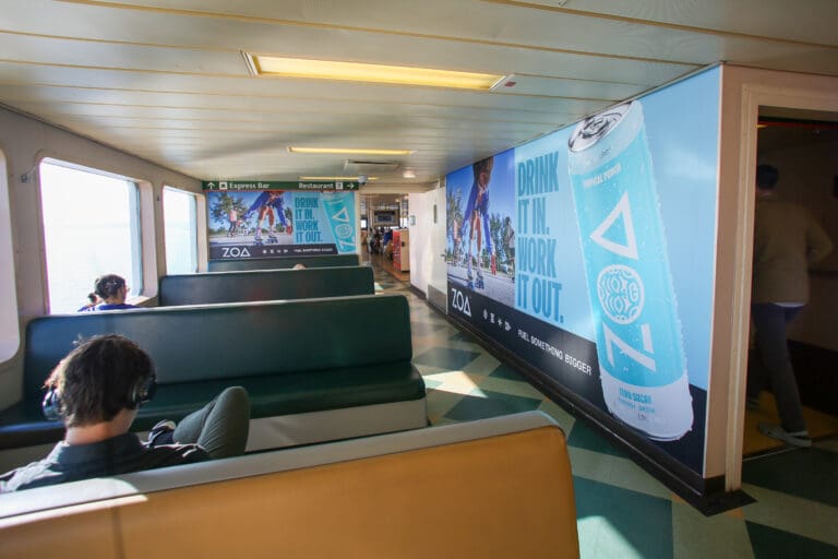 outdoor advertising on the washington state ferry walls in seattle displaying zoa energy