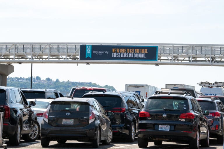 outdoor advertising at the colman terminal in seattle with city university of seattle