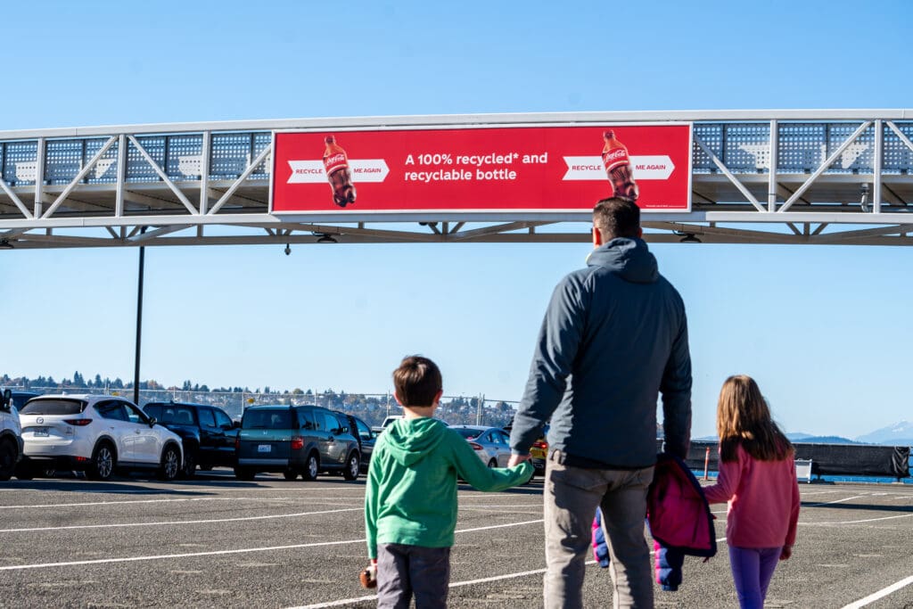 Outdoor advertising for coca cola on a Washington State Ferry passenger bridge.