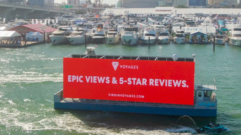 Ditigal outdoor advertisement for Virgin Voyages on billboard boat.