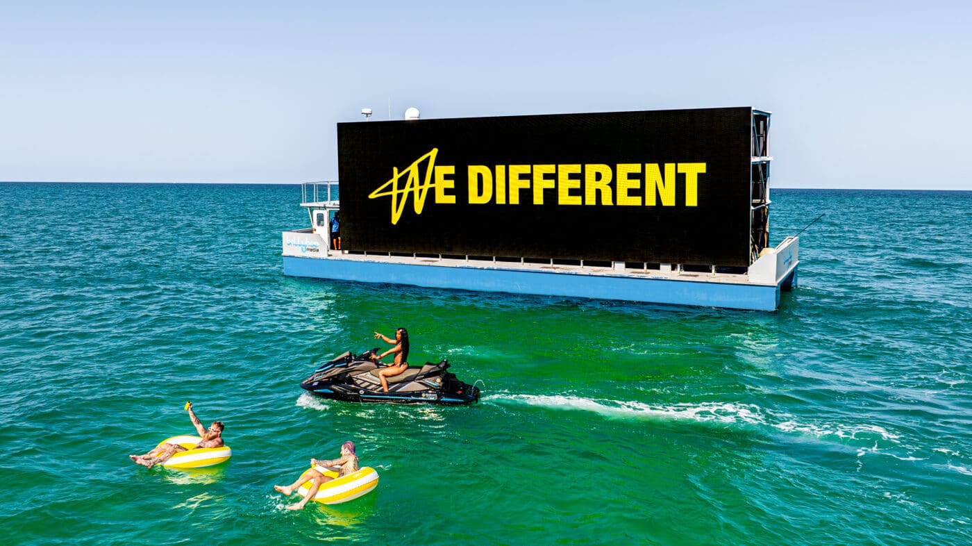 "We different" campaign on the water, promoting Jake Paul's new product.