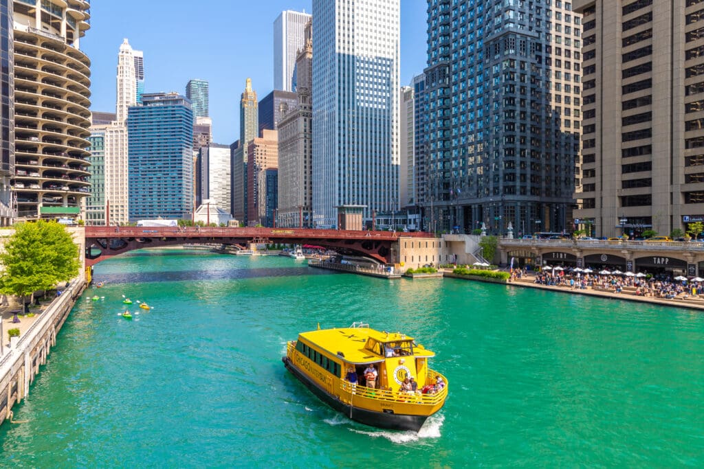 Aerial view of Chicago Water Taxi approaching LaSalle Street Bridge with views of Marina City and the Merchandise Mart, ideal for large-format OOH campaigns along the river.